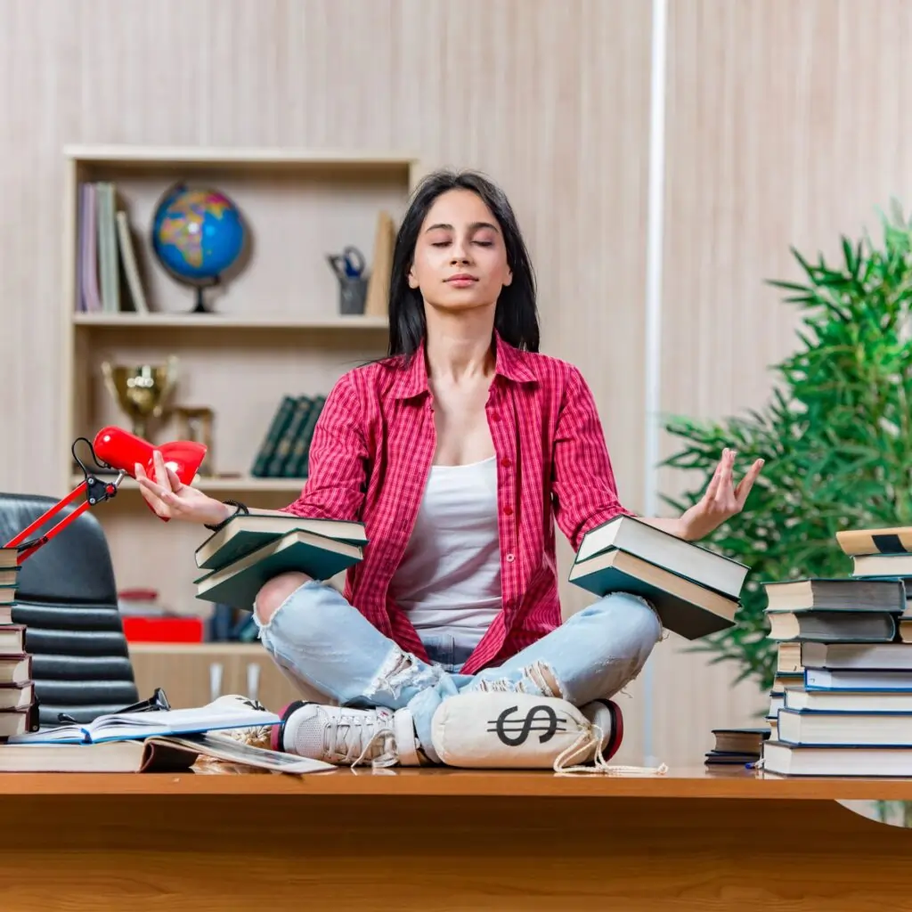 student meditation next to books tutoring