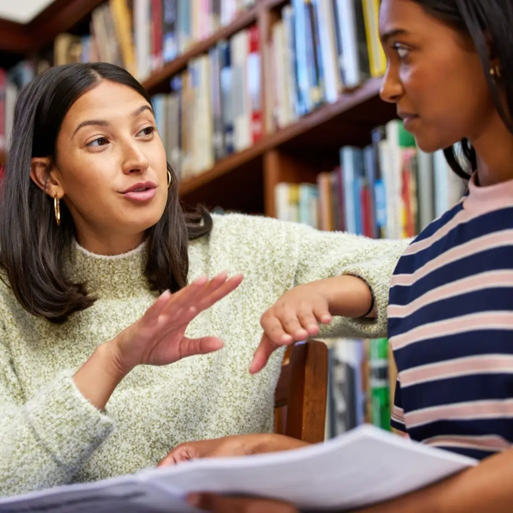 tutoring teacher talking to student